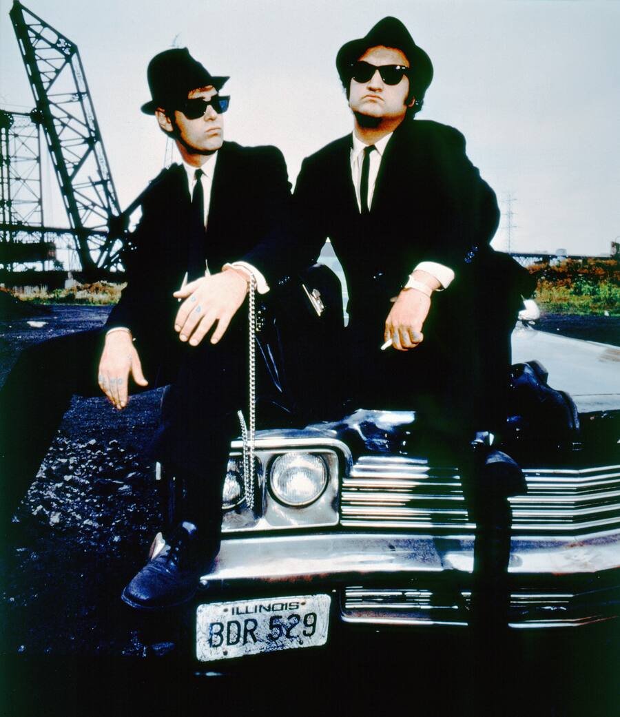 Canadian actor and screenwriter Dan Aykroyd and American actor John Belushi on the set of The Blues Brothers directed by John Landis. (Photo by Sunset Boulevard/Corbis via Getty Images)